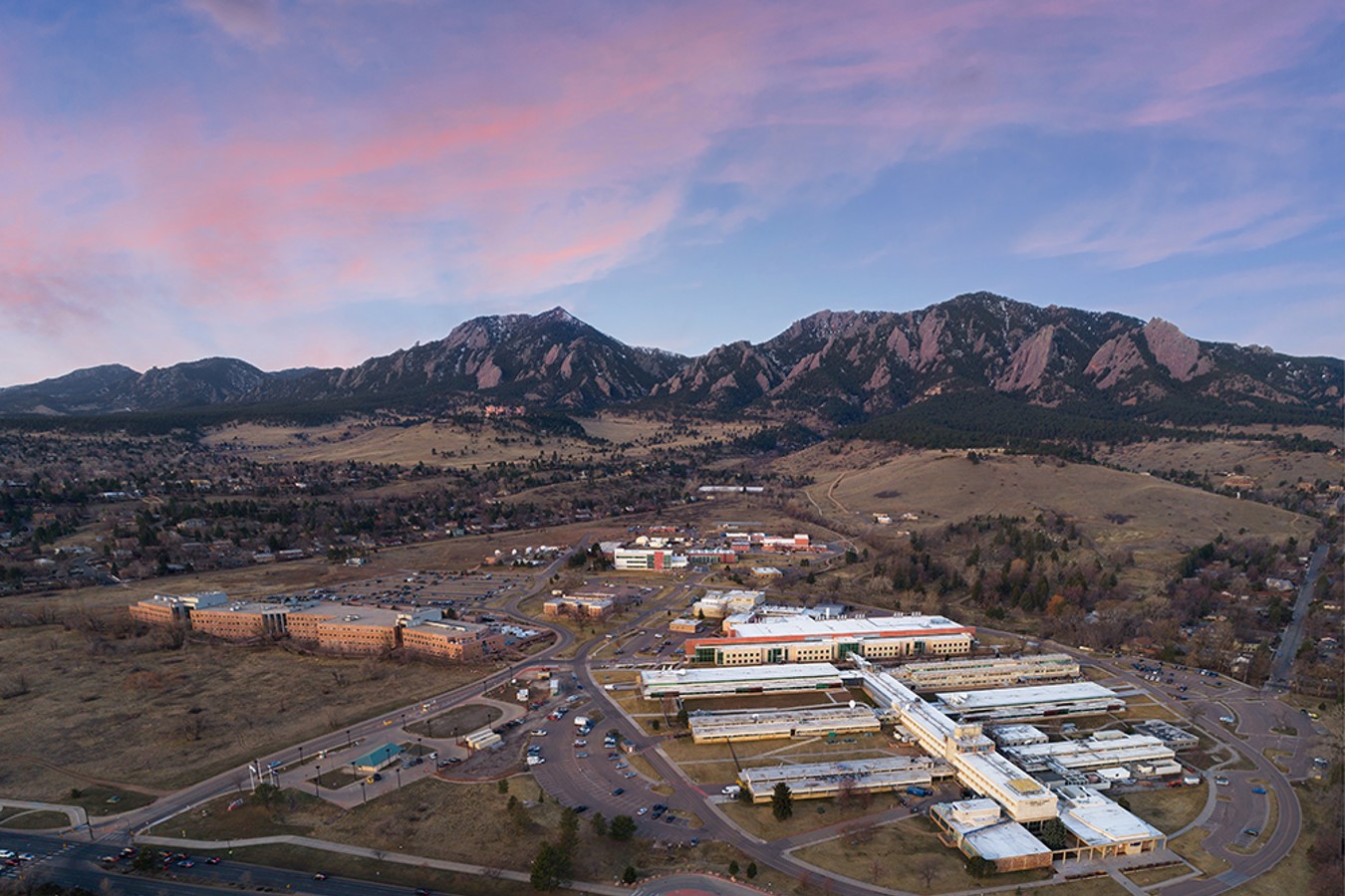 Early morning aerial view of NIST's Boulder, Colorado, campus, the Flatiron Mountains are in the background